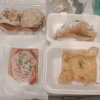 Cinnamon bun, feta danish, pistachio croissants, and raspberry pop tarts  at Canela in Calgary