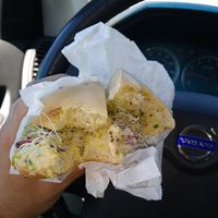plain bagel with hommus, sprouts & onion at Pearl Street Bagels in Jackson