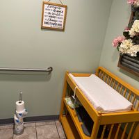 Their bathroom with a baby changing station.  at The Pink Bean in Somerset
