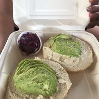 Avocado and cream cheese bagel ordered by my non vegan sister!  at Holi Vegan Kitchen in Miami