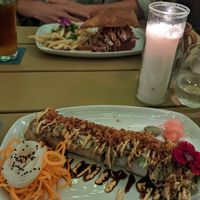 The pulled no-pork focaccia sandwich in the background at Once:Once in Antigua