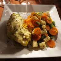 Baked potato with rice filling and steamed vegetables.  at Rancho Grande in Villa General Belgrano