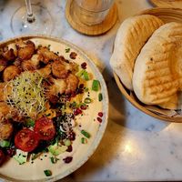 Humus, crispy Tofu, avocado, cauliflower at LUUC Café in Saarbrucken