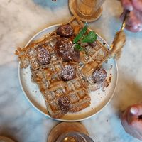 Vegane Waffeln mit hausgemachter "Schoko"sauce und Bananen at LUUC Café in Saarbrucken