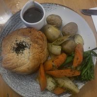 Mushroom Wellington with its side of well-seasoned root veggies and gravy  at Tullie Inn in Balloch