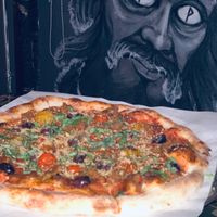 Frailty Pizza with Wall Art at The 4th Horseman in Long Beach