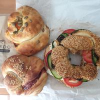 Two types of acmas, Simit salad sandwich at Kardo Cafe and Eatery in Melbourne