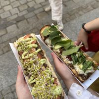 On the left is vegan with tofu and sprouts, right is vegetarian with sundried tomatoes and cheese.  at Długa Buła in Torun