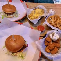 Spicy bean burger, cheesy fries, quorn nuggets, beer battered onion rings at Boo Koos in Helston