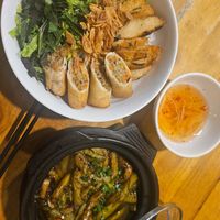 Noodles with spring rolls and braised aubergine at Sen Vegan House in Ho Chi Minh City