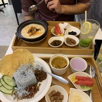 Nasi lemak and a porridge dish at Minf Houze Vegan Cafe in Kuala Lumpur
