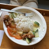 Fried mushrooms with pineapple cucumber and tomato plain ricee  at Minf Houze Vegan Cafe in Kuala Lumpur