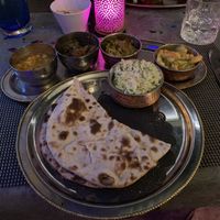 Picture shows a vegan Thali. Indian dish where you get 4 different curries, rice and naan bread. Only available upon request. Ask server for vegan option. at Tamarind Hill in Zurich