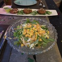 Indian summer salad and pan fried potato cakes accompanied by a tamarind-date sauce, mint and green apple chutney. at Tamarind Hill in Zurich