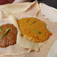 Injera with lentils in spicy red sauce and mild chickpeas, both delicious at Ethiopisch Eethuis Sarah in Leeuwarden