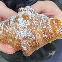 Vegan croissant 🥐 my first one in years! as you can see my partner got too excited and could not wait to take a bite 😂 at Dolce Capriccio Pasticceria in Oviedo