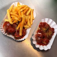 Vegan currywurst and one with chips  at Curry 61 in Berlin