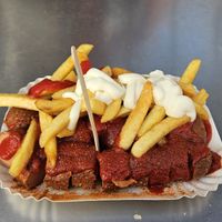 2 vegan currywurst with fries, ketchup, curry powder, and vegan mayo. at Curry 61 in Berlin