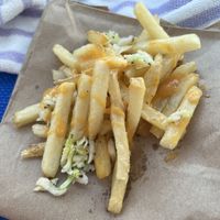 Fries loaded with the scott-tee sauce and coleslaw!  at Hot Dog Tommy's in Cape May