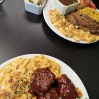 Jerk bites and mac and cheese (front) and sunday roast (back) at Earth's Kitchen  in Birmingham