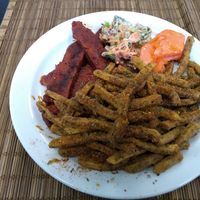 BBQ "ribs", seasoned fries, kale coleslaw (very tasty), papaya. at Earth's Kitchen  in Birmingham