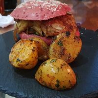 Vegan burger (plantain and almonds as a filling) - the potatoes were amazing! at Morphos in Monteverde