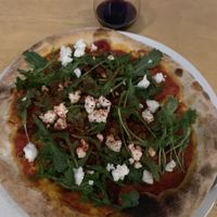 Dry tomato pizza and Primitivo wine at Havana in Warsaw