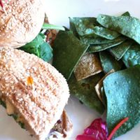 Golden Mean burger with tortilla chips. at Golden Mean in Santa Monica
