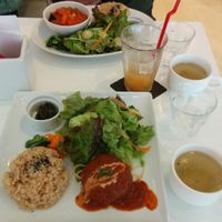 Their popular veggie burger plate & the daily lunch special in the background.  at Hanada Rosso in Tokyo
