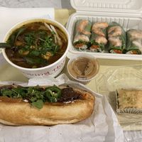 Food tray - banh mi, spicy noodle soup, fresh roll, baklava   at Loving Hut in San Jose