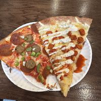 Everything and Buffalo Chick’n slices  at Artistic Pizza in New York City