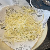 Uneaten vegan cheese after they didn’t melt it   at Balls and Bangles in Queenstown