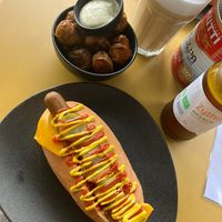 Original hot dog with added cheese and side of potatoes  at Not Dog in Nice