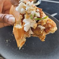 Crumbled vegan feta and crushed walnuts on top and other filings inside. The seitan hotdog in the hotdog bun was super yummy. at Not Dog in Nice