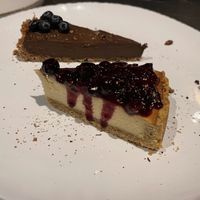 Front: Cheesecake with forest fruits Back: avocado and cacao raw slice  at Green Kukunari in Crete