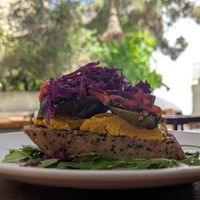 Homemade Multigrain Bread with hummus, marinated vegetables with garlic, and red cabbage at Green Kukunari in Crete