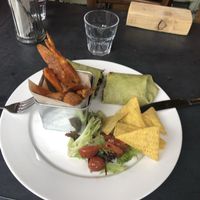 Burrito and sweet potato wedges   at Greens Vegan in Cardiff