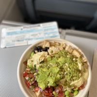 Delicious bowl with brown rice, black beans, tofu, edamame, pico de gallo, hummus AND guac - topped with pepitas!! So satisfying! Thanks PHL! ✈️🌱🙌 at PHL - Currito - TD in Philadelphia