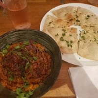 Tomato risotto and garlic and herb flatbread at Encore  in Chorley