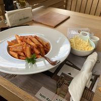 Pasta arrabiata with vegan cheese on the side  at Lupo D'Argento in Zabljak