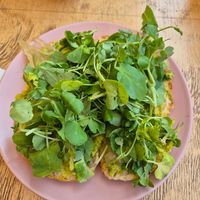 Tostada palta con berros y salsa de cebolla dulce at Cafe Del Barrio in Santiago