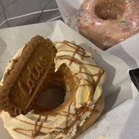 Vegan strawberry doughnut In the background  at The Oakleigh Doughnut Co in Oakleigh