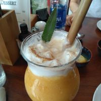 Vegan smoothie made from pineapple, mango and another fruit that I didn't remember. Topped with vegan coconut cream at Hanoi Taco Bar in Hanoi