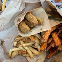Regular fries, sweet potato fries, and fried pickles (all vegan)  at Wieners of Waterton in Waterton Park