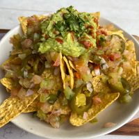 Nachos with guacamole, pico de gallo and jalapeños  at Surf House in Barcelona