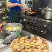 Making the food right before it came out! at Cornucopia Natural Market & Deli in Galesburg