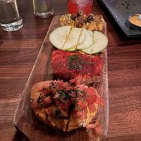 Bruschetta Board with modified toppings. I asked to swap cheeses for almond hummus. Tasted great. But I didn’t know until I got the bill each swap was +$3!   at Postino Central in Phoenix