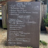 Vegan cheesecake and chocolate cake in the extensive cake menu  at Der Schafstall in Handeloh
