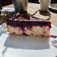 Vegan cheesecake with raspberry and blueberry topping (only says vegan cheesecake on the menu)  at Der Schafstall in Handeloh