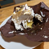 Messy photo but to show you that the insides of this incredible brownie had cream, with delectable panna. at Leccornie in Milan